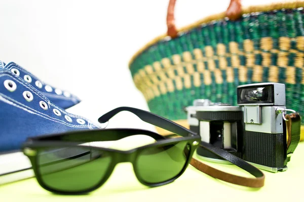 Sneaker analogue camera and handbasket — Stock Photo, Image