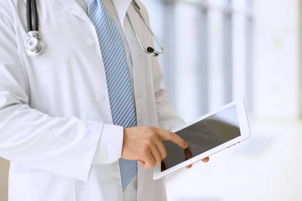 Doctor using a digital tablet, close-up of hands. Health care concept — Foto Stock
