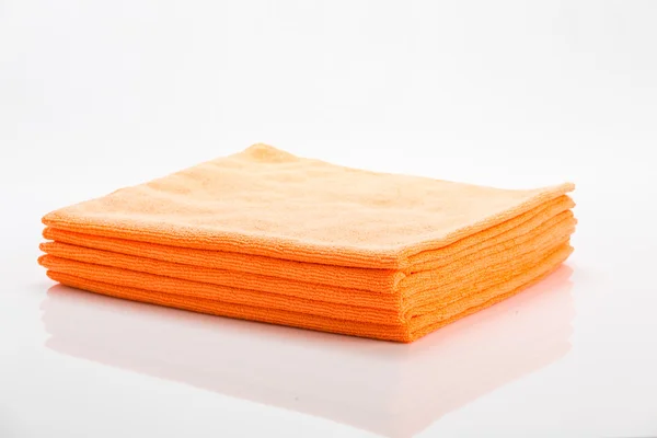 Orange cleaning clothes isolated on white — Stock Photo, Image
