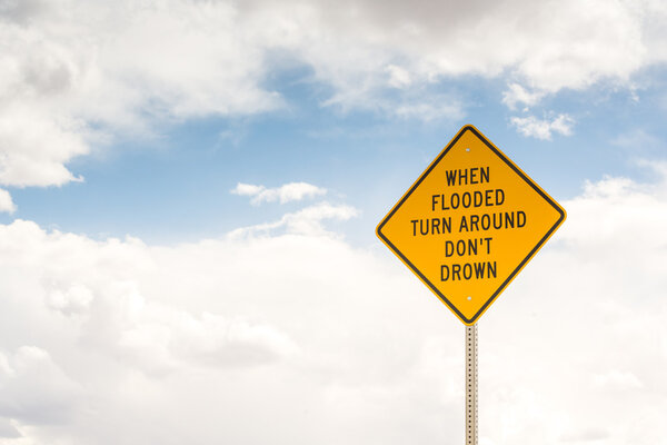 When flooded turn around. Road sign