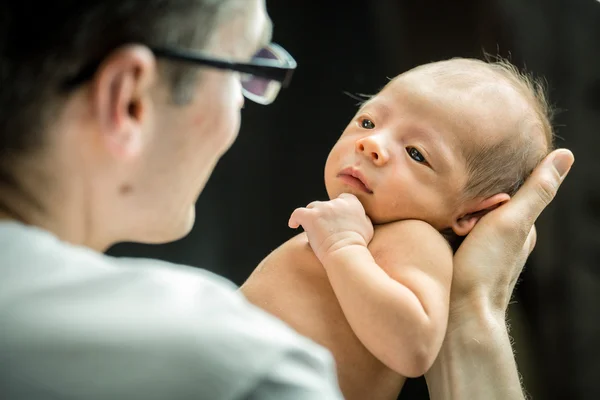 Happy father holding with love his new born son — Stock Photo, Image