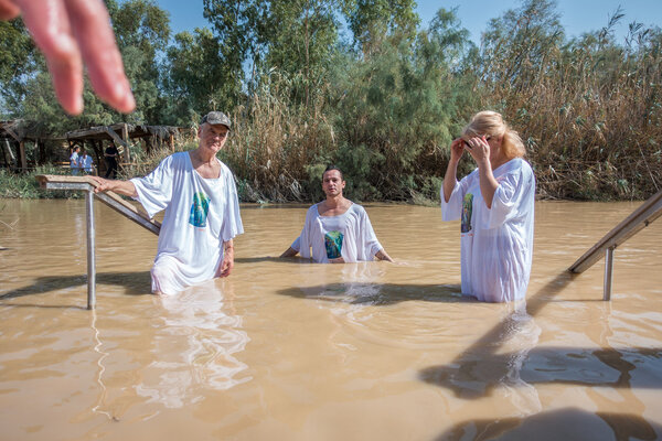 Baptism for pilgrims in river of Jordan, the place which is beli