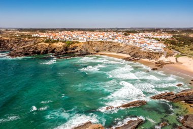 Aerial view of Zambujeira do Mar - charming town on cliffs by the Atlantic Ocean in Alentejo, Portugal clipart