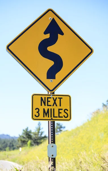 Winding road next 3 miles, road sign — Stock Photo, Image