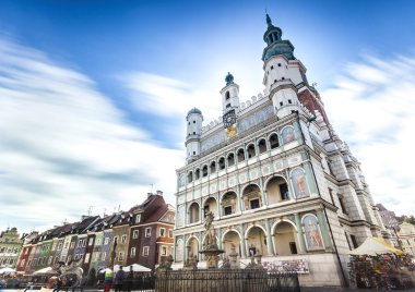 Historic Poznan City Hall located in the middle of a main square clipart