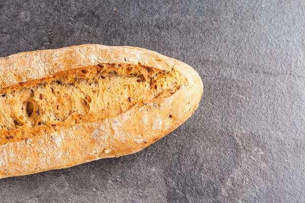 Delicious bread on grey background — Stock Photo, Image