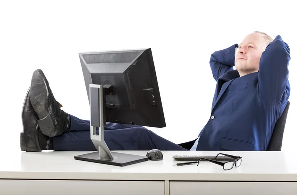 Homem de negócios relaxado em seu escritório — Fotografia de Stock