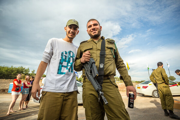 Two Israeli soldiers posing to the photo