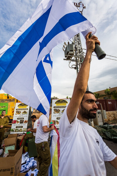 Israeli soldier with national flag