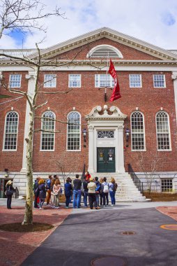 Lehman Hall and tourists in Harvard University in Cambridge clipart