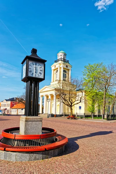 Clock and Lutheran Church of Saint Nicholas in Ventspils — Stock Photo, Image