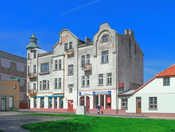 Old building with tower in Ventspils — Stock Photo, Image