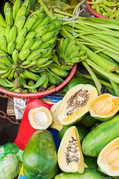 Street Market selling bananas and papaya in Vietnam