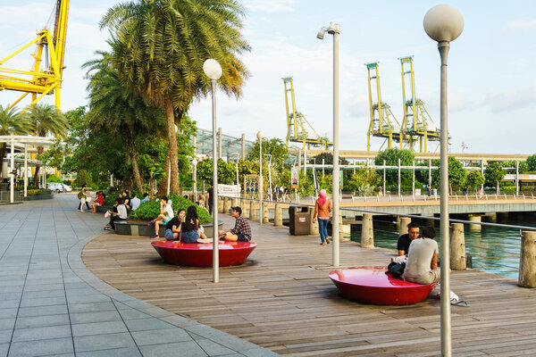 Tourists at Sentosa Boardwalk leading from Singapore Mainland to
