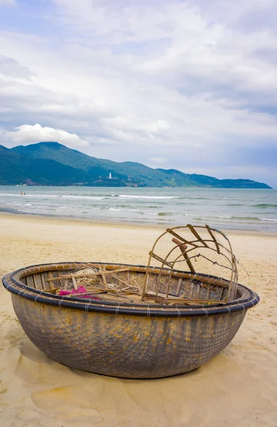 Mountains and Bamboo boat at China Beach in Danang Vietnam Stock Image