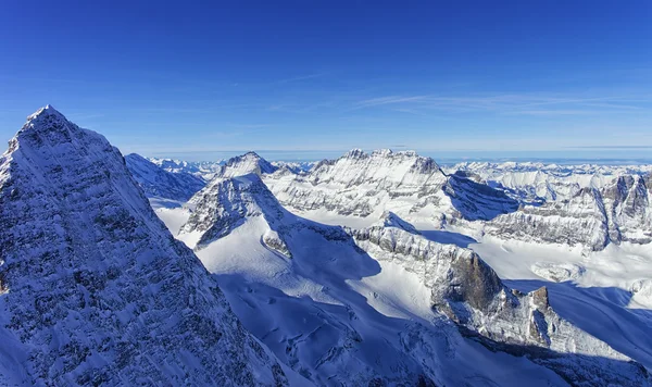 Raw of snow peaks in Jungfrau region helicopter view in winter — Stock Photo, Image