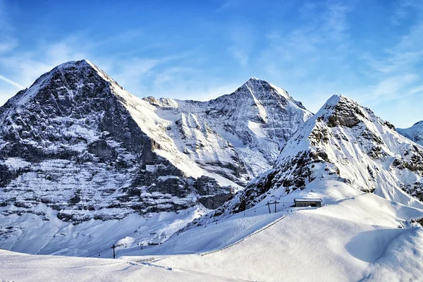 Swiss alpine peaks and ski slopes in winter — Stock Photo, Image