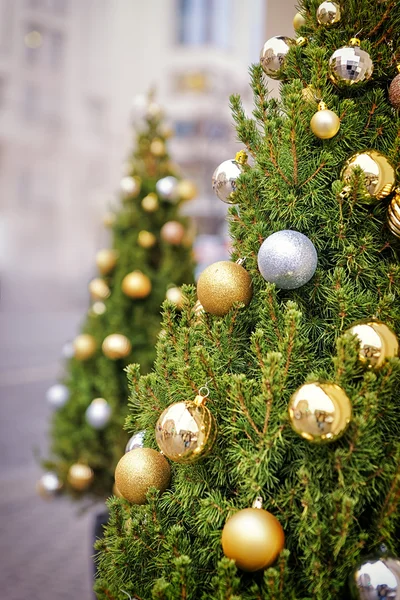 Silver and golden decorating balls on the christmas tree at the — Stock Photo, Image