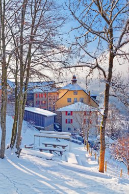 Snow-covered medieval buildings of the town of Gruyeres