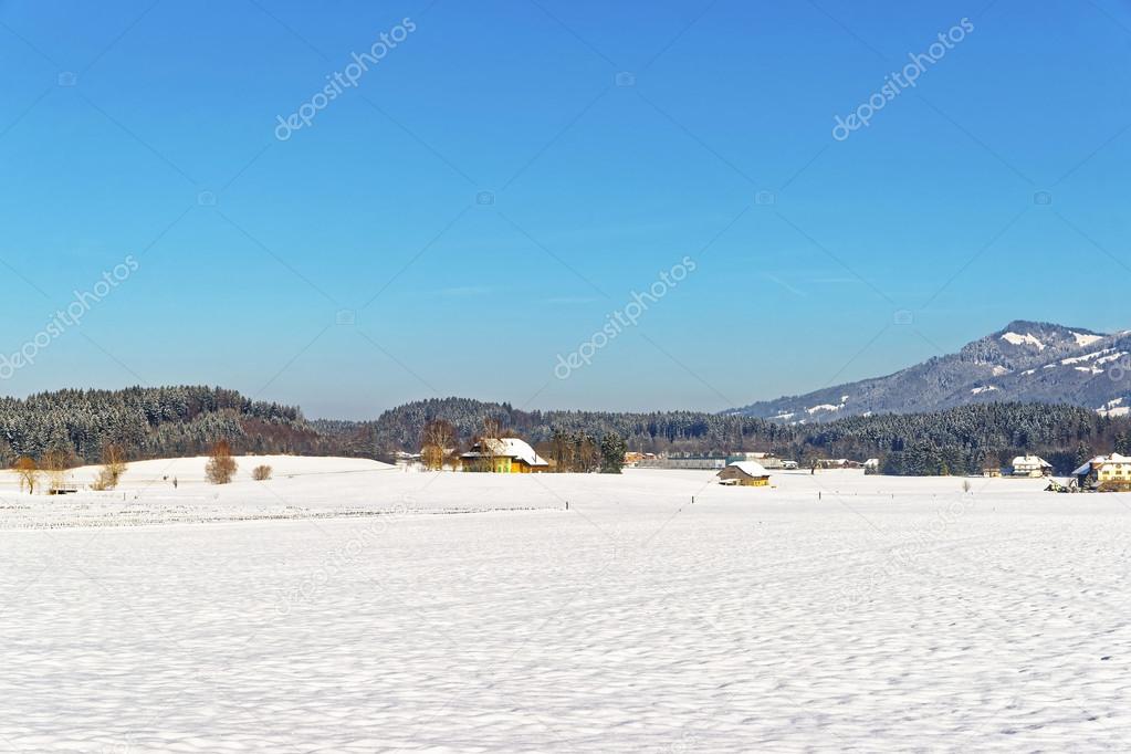 View of countryside in snow covered Switzerland in winter