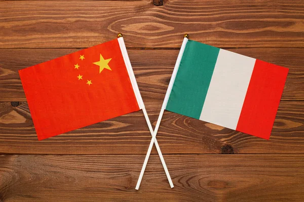 Flag of China and flag of Italy crossed with each other. The image illustrates the relationship between countries. Photography for video news on TV and articles on the Internet and media.