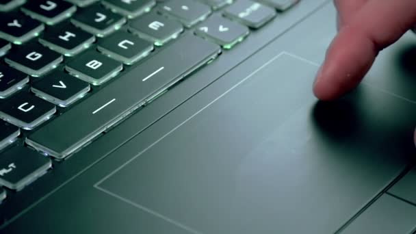 Man using touchpad on notebook keyboard — Stock Video