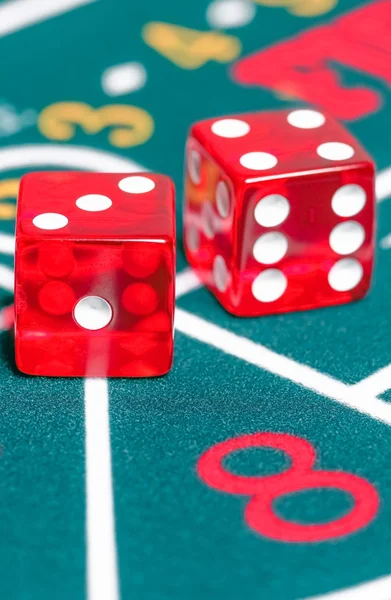 Two red dice on green gambling game — Stock Photo, Image