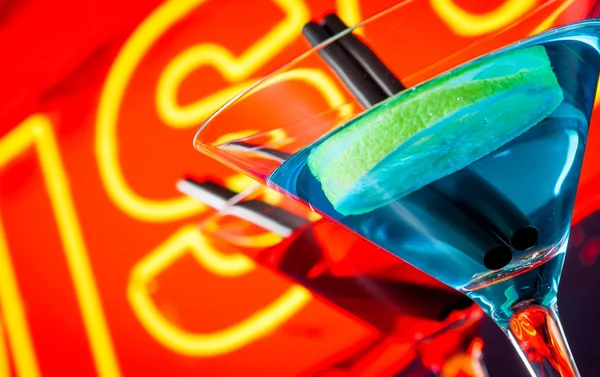 Detail of cocktail with neon disco word background with space for text — Stock Photo, Image