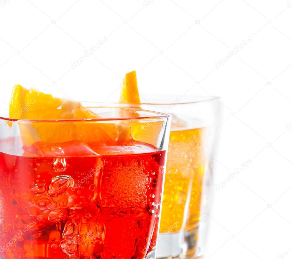 detail of two cocktail with orange slice isolated on white background