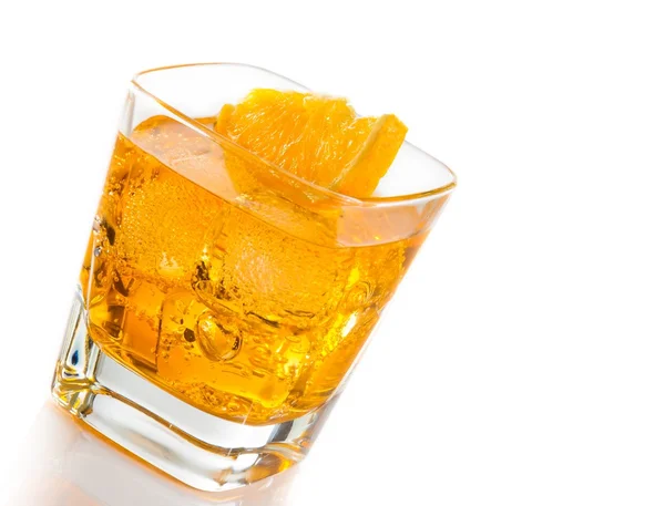 Yellow cocktail tilted with orange slice isolated on white background — Stock Photo, Image