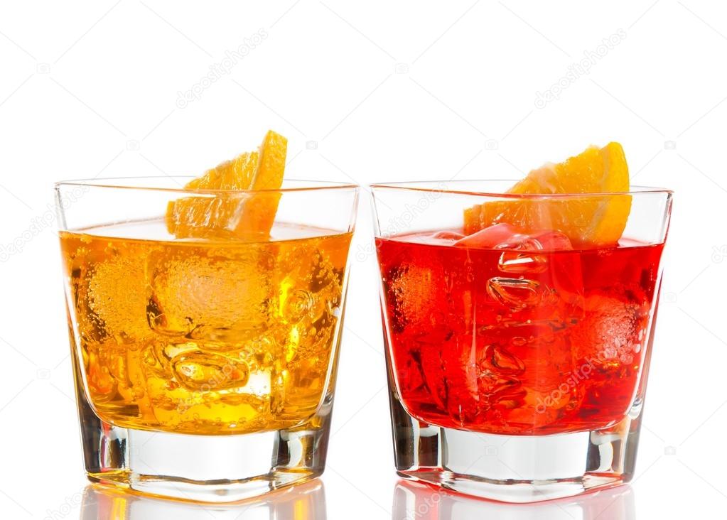 red and yellow cocktail with orange slice on top isolated on white background