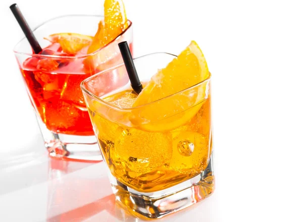 Two cocktail with orange slice and straw on top isolated on white background — Stock Photo, Image