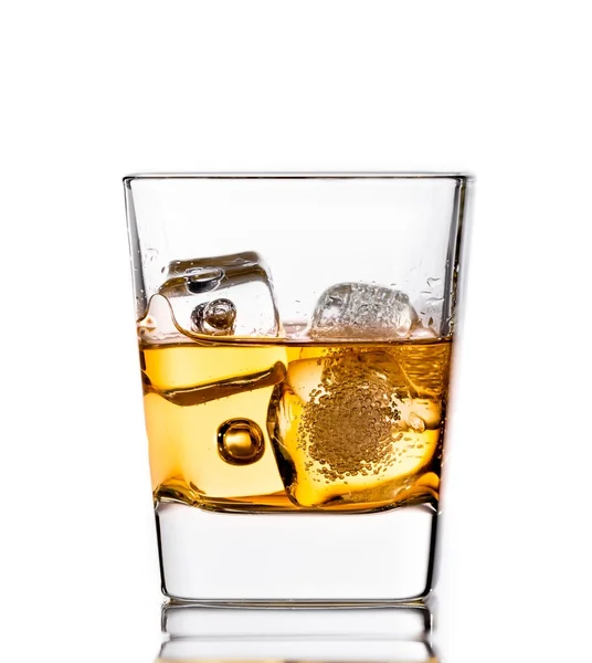 Scotch whiskey in glass with ice cubes on white — Stock Photo, Image