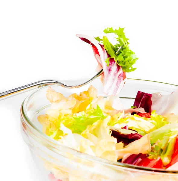 Detail of fork on italian fresh salad on white — Stock Photo, Image