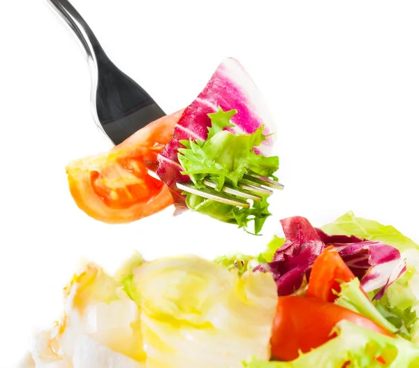 Fork on italian fresh salad on white — Stock Photo, Image