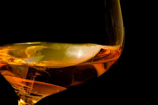 Brandy in elegant glass tilted with space for text — Stock Photo, Image