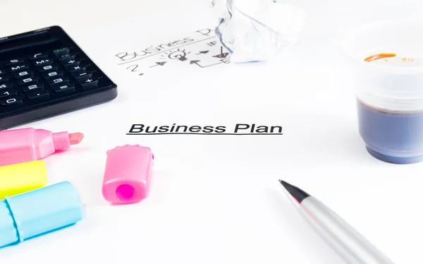 Business plan words near highlighters, calculator and cup of coffee, business concept — Stock Photo, Image