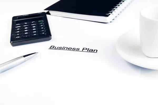 Business plan words near calculator, pen and cup of coffee, business concept — Stock Photo, Image