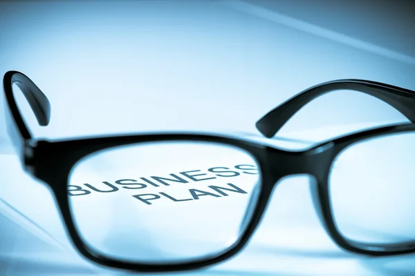 Business plan words see through glasses lens, business concept — Stock Photo, Image