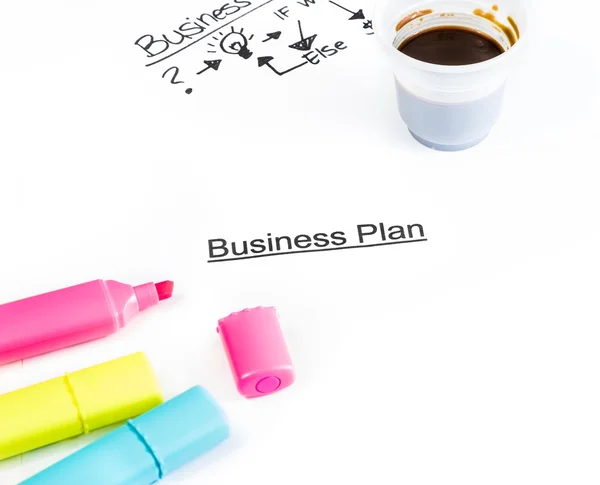 Business plan words near highlighters and cup of coffee, business concept — Stock Photo, Image