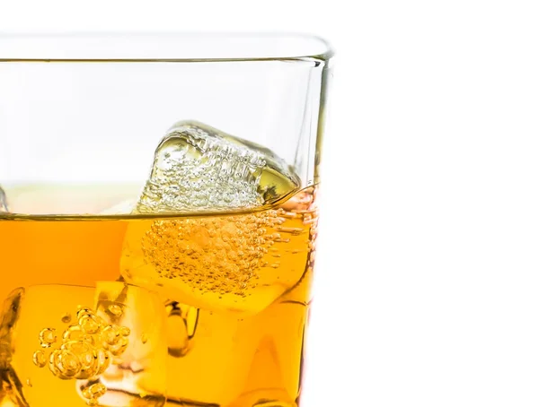 Whiskey in glass with ice on white background — Stock Photo, Image
