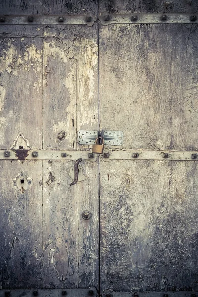 Aged dark vintage wooden door as background — Stock Photo, Image