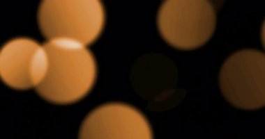 Noel altın gradyan pırıltılı glitter toz parçacıkları siyah arka plan üzerine üstten bokeh akan hareket, tatil mutlu yeni yıl ve Sevgililer günü aşk, ilişki