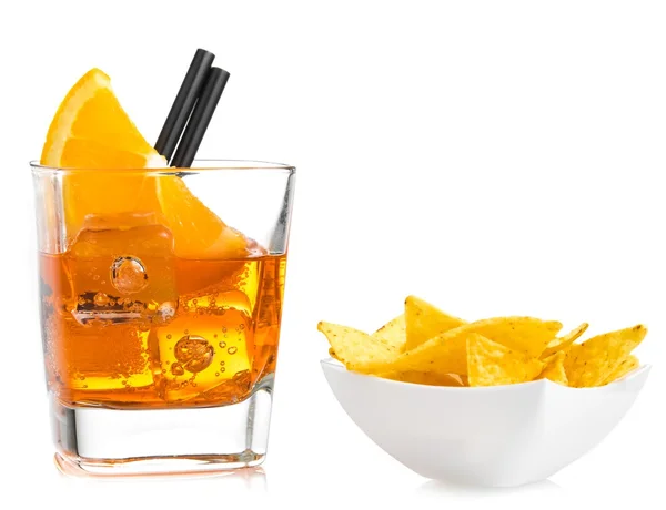 Hot tacos chips in front of glass of spritz aperitif aperol cocktail with orange slices and ice cubes — Stock Photo, Image
