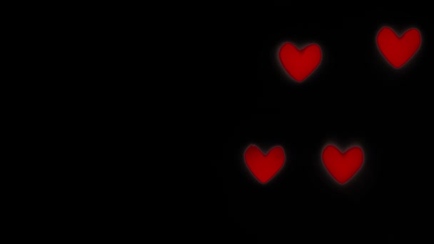 Abstraktní skutečné červené srdce bokeh na černém pozadí, blahopřání, pozdrav valentine den a láska — Stock video