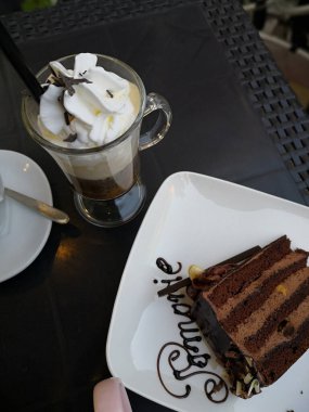 chocolate cake and ice cappuccino coffee . A slice of rich moist devil's food chocolate cake - photographed