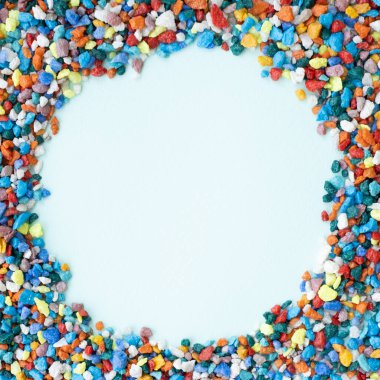 mock up circle background. empty card for your text. Colored stones. background small stones for the aquarium of different colors