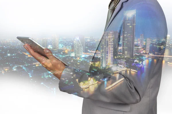 Double Exposure image of Businessman use Digital Tablet and City — Stock Photo, Image