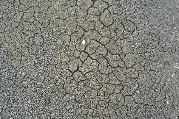 Popraskané půdy suché země nebo země textury pozadí — Stock fotografie