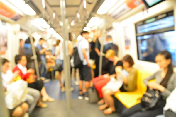 Abstract blurred people standing in electrical sky train — Stock Photo, Image